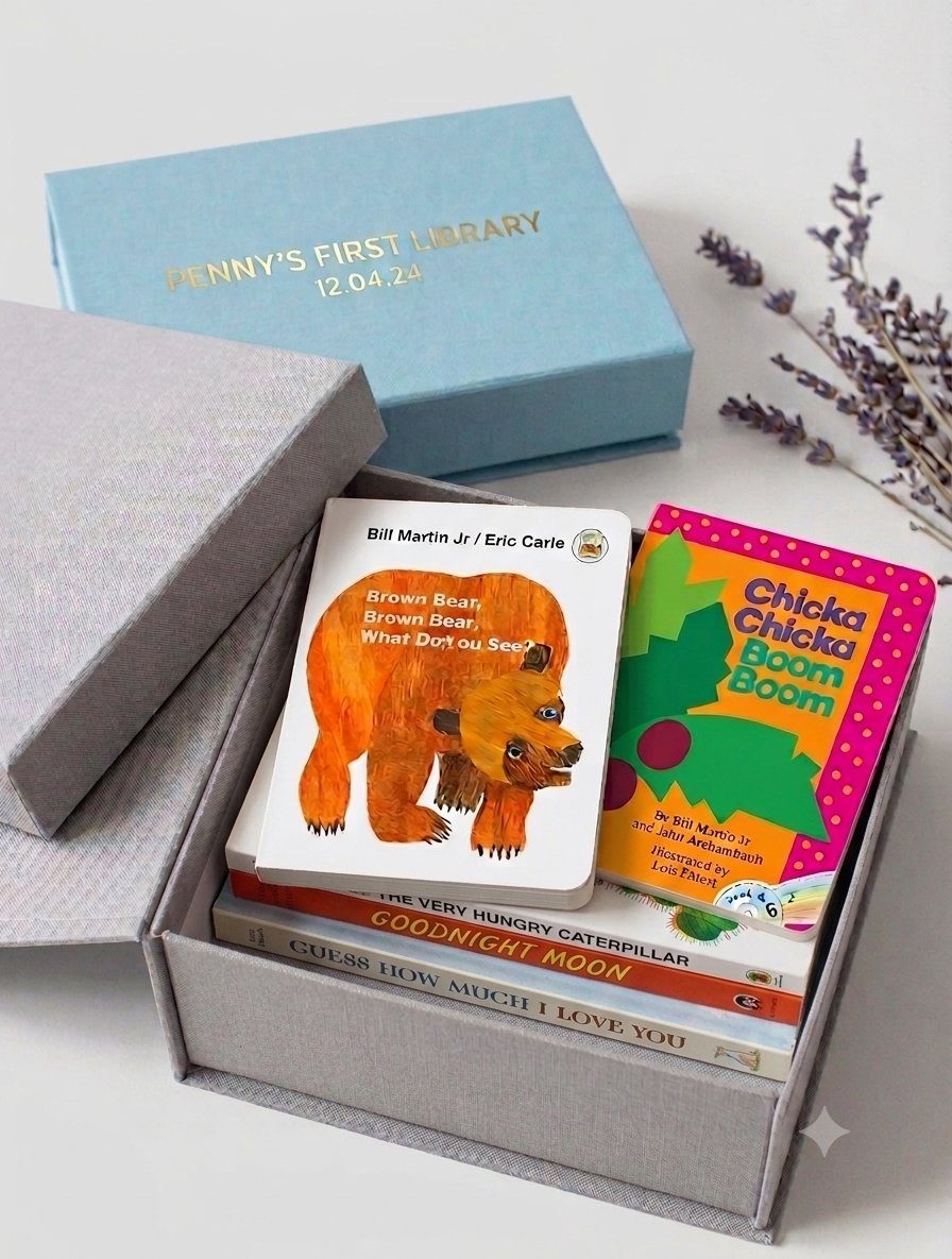 A foil-stamped linen keepsake box with story cards and picture books inside